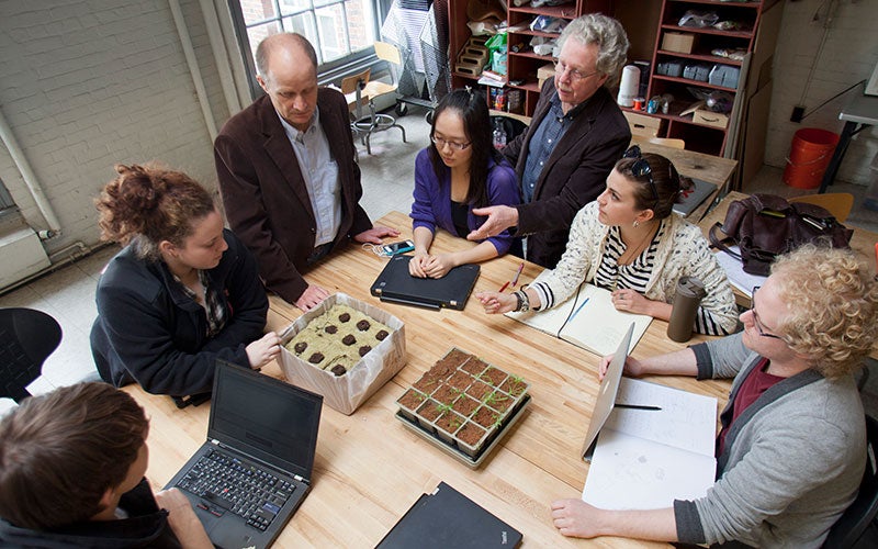 Students and professors in small group discussion