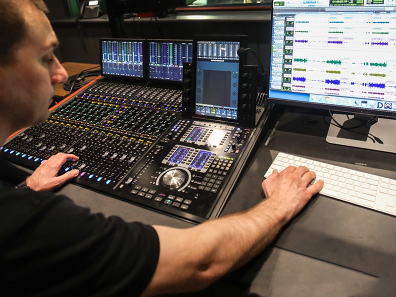 Student working on an audio board