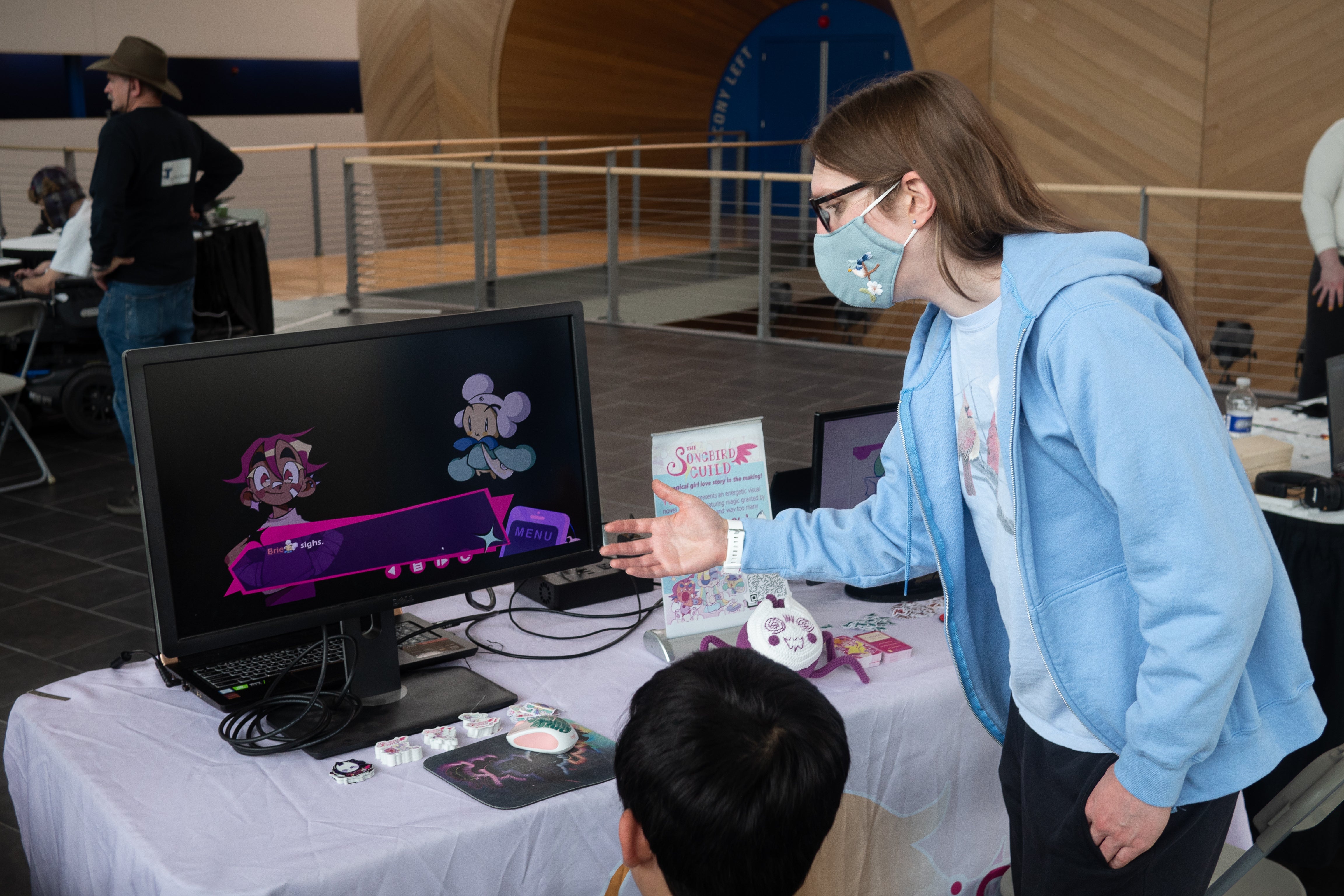 GSAS students looking at one of their projects on a computer screen