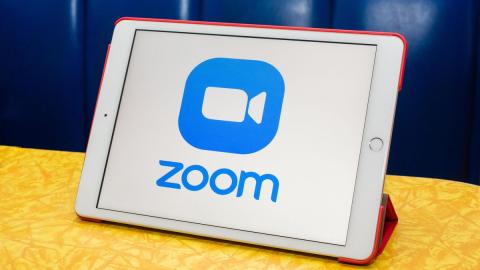 a tablet showing the zoom logo