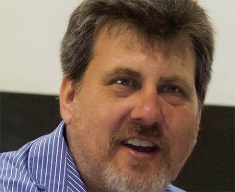 Dr. Rouder, a caucasian man with brown hair and goatee, smiling